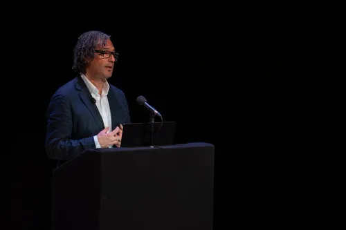 David Olusoga speaking behind a leactern