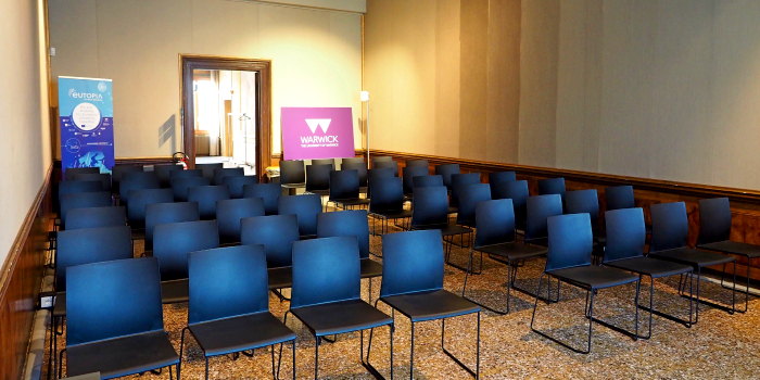 A large room filled with multiple rows of chairs