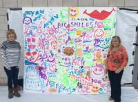 Smile wall artwork at the fostering families big day out 2016 at the University f Warwick