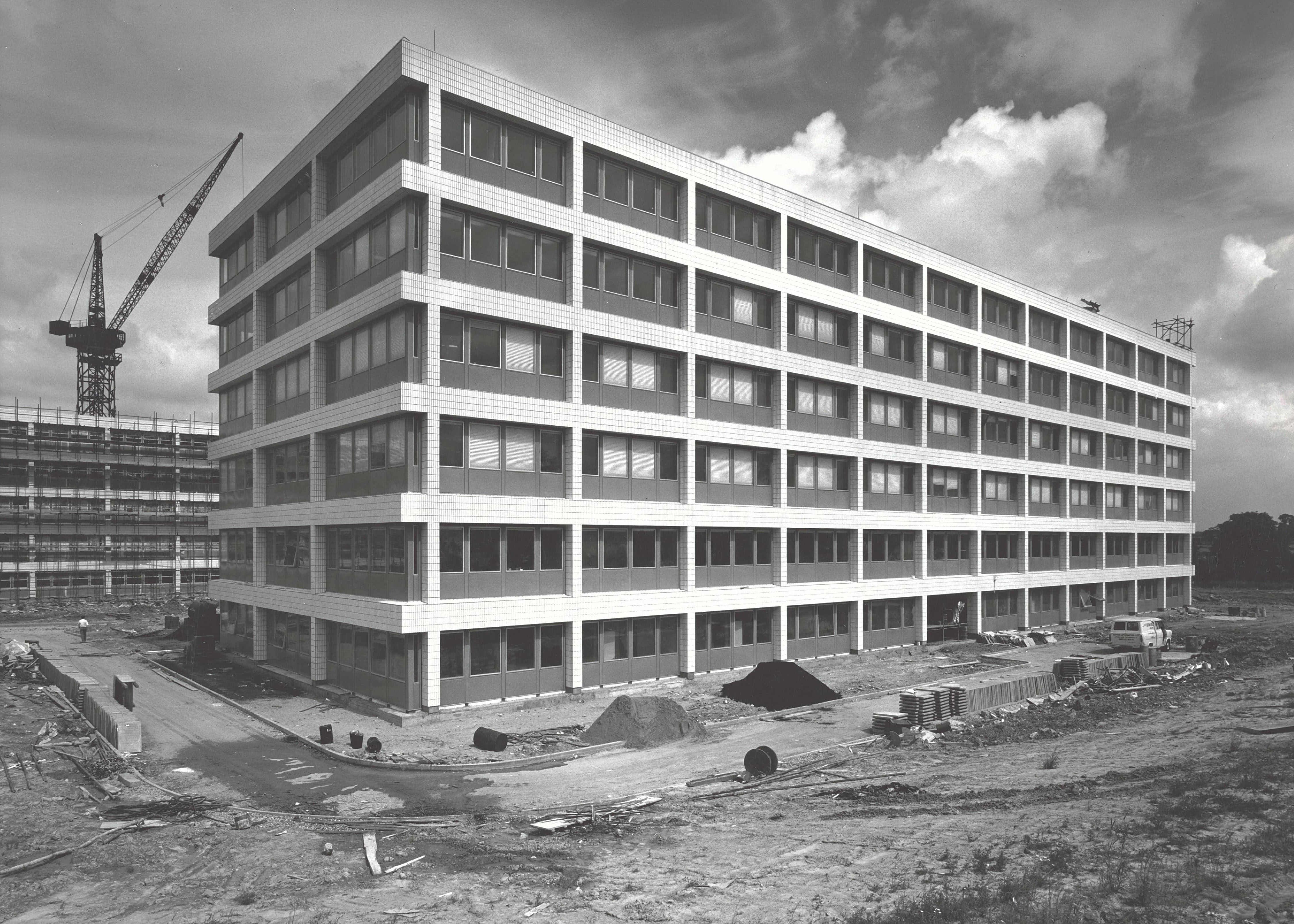 The original library building shortly after completion with paths around it still under construction