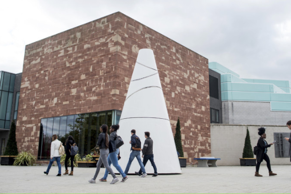 Students walking past the Koan on University of Warwick campus