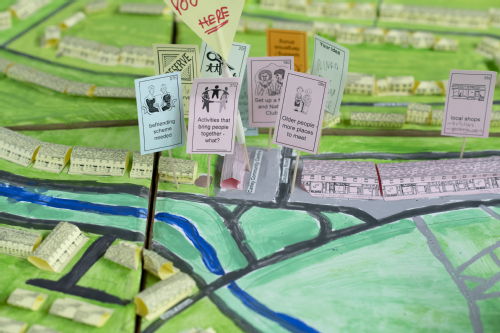 A close up of a 3D map with signs sticking out of it