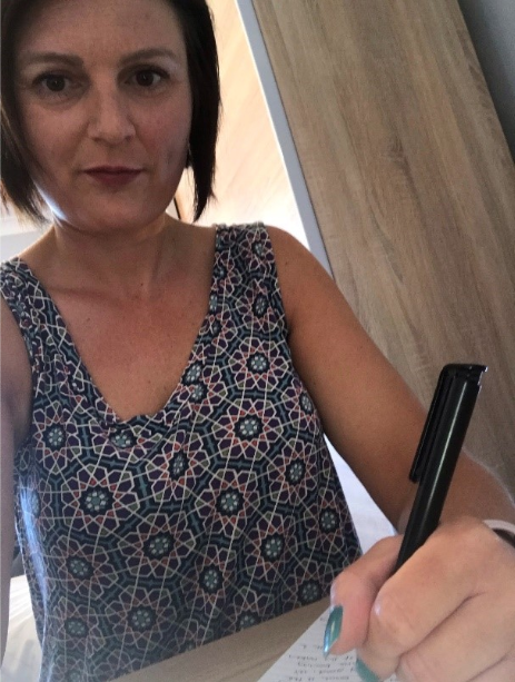 Lisa Randle writing a letter