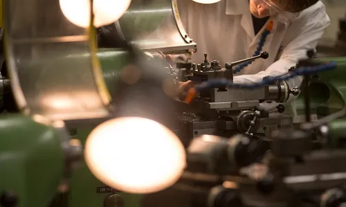 A degree apprenticeship student working in a technical environment