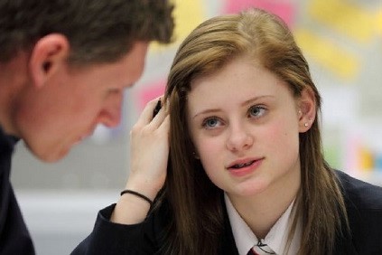 A student and a teacher in discussion.