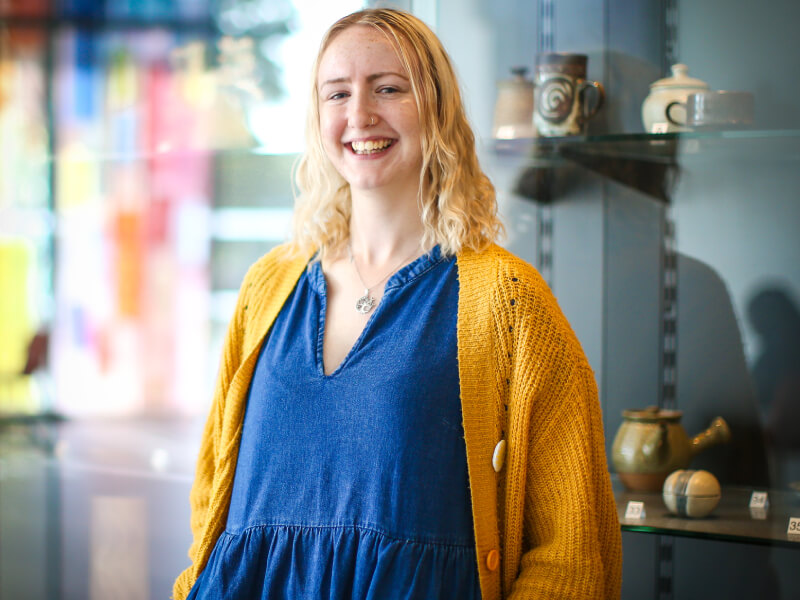 Kate stood in front of pottery