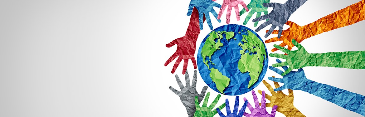 A collage image of multicoloured paper hands encircling the globe