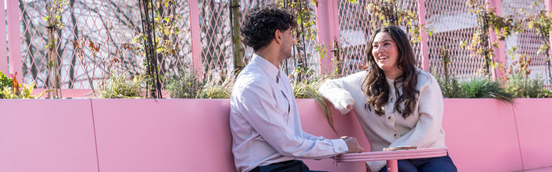 Photo of female and male smiling