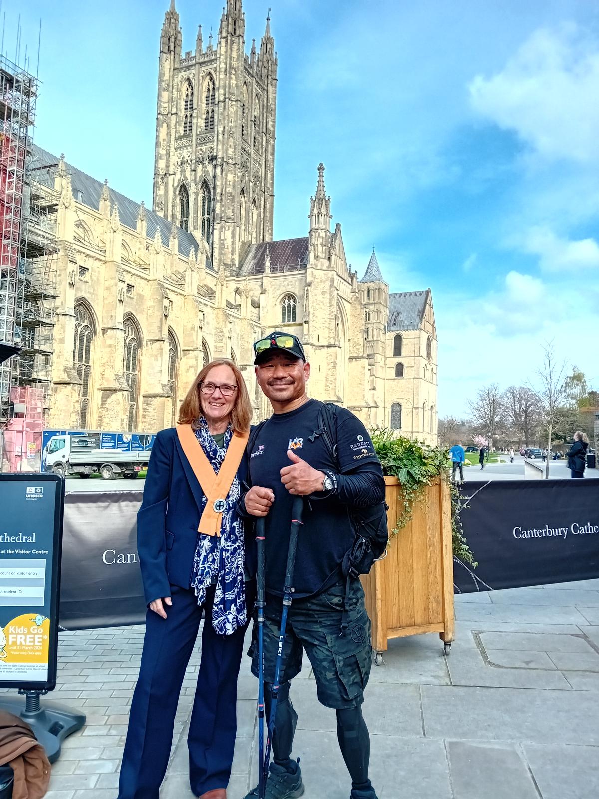 Aileen in front of the cathedral with someone in walking gear