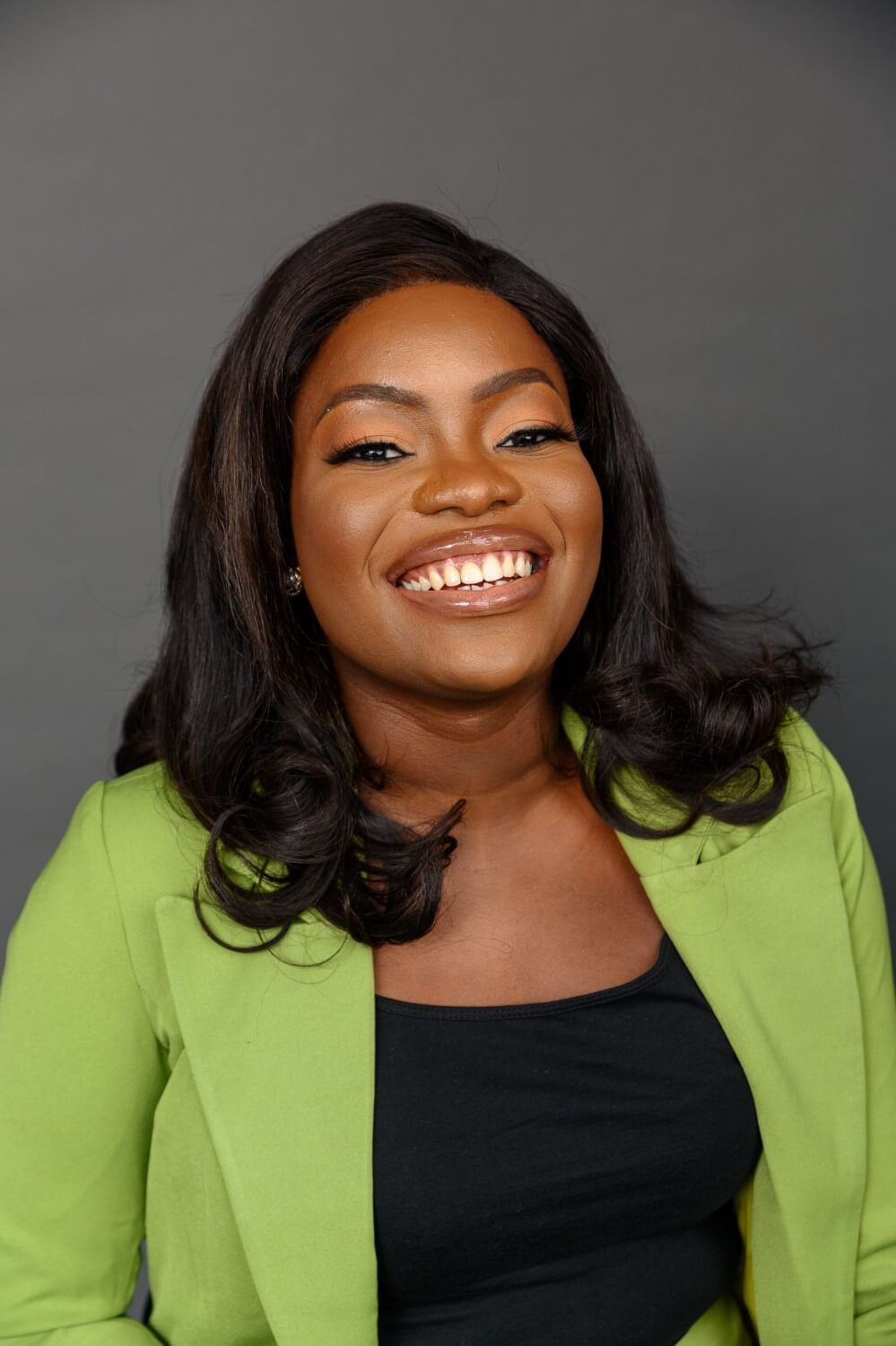 Toyosi Ayoola wearing a green blazer