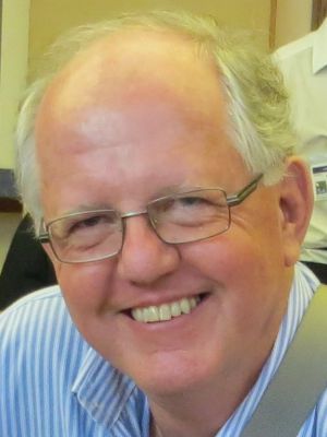 Laurence smiles at camera