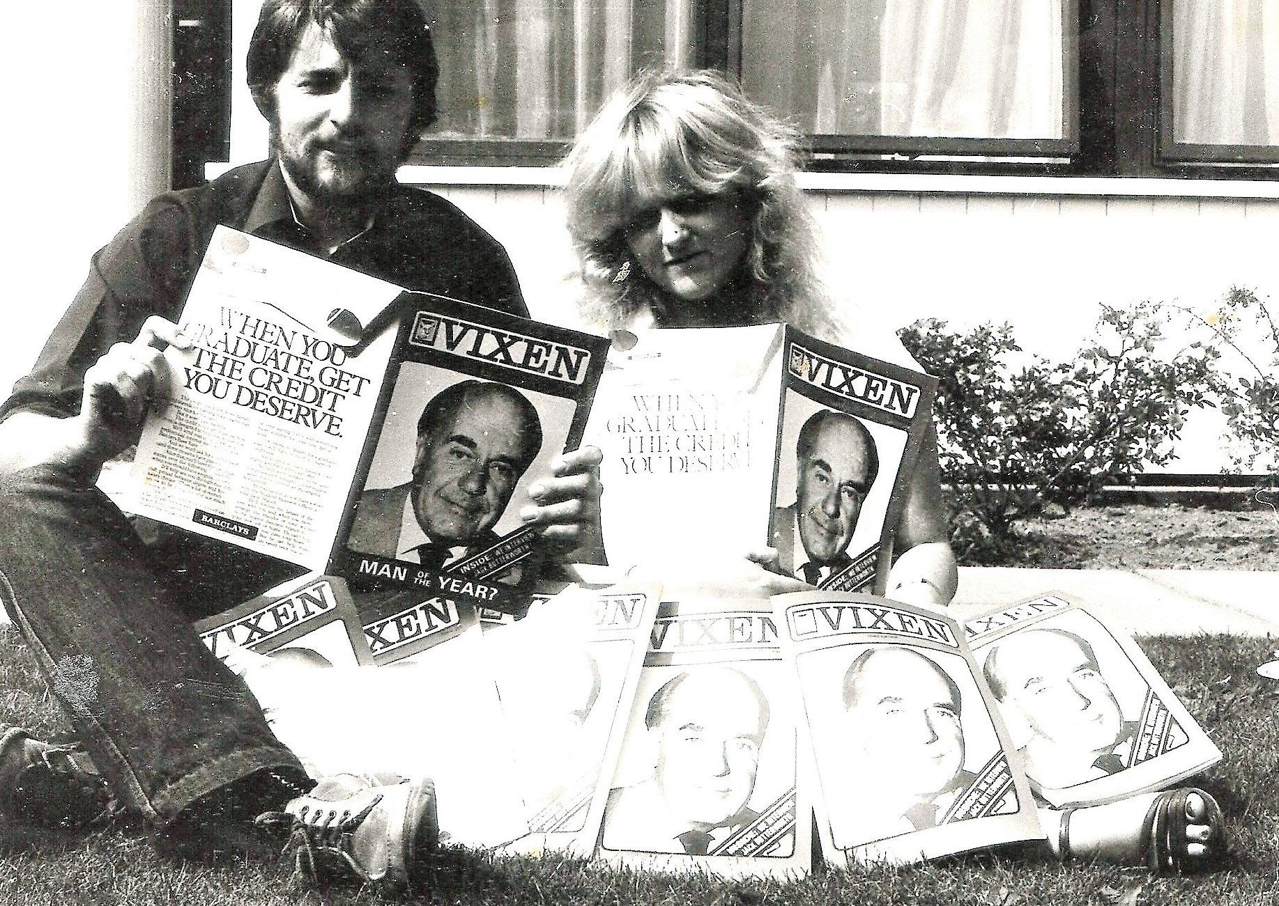 Black and white image of Angela holding up copies of the Vixen