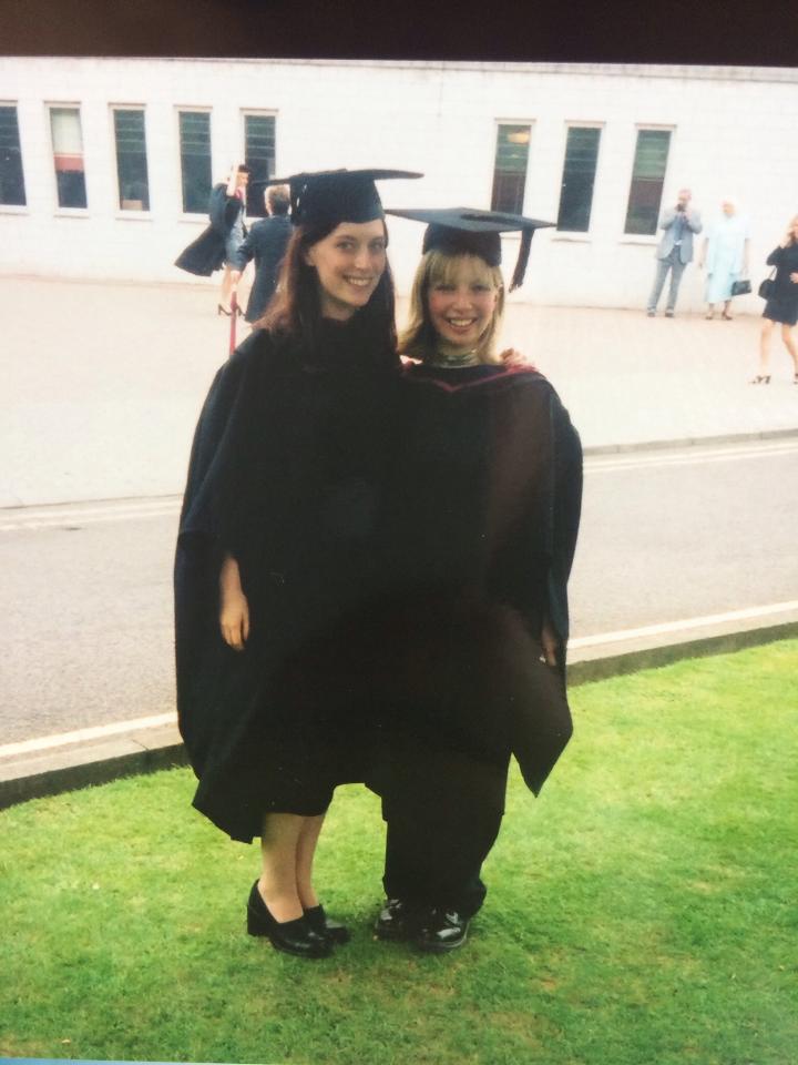 Laura and a friend in their graduation robes
