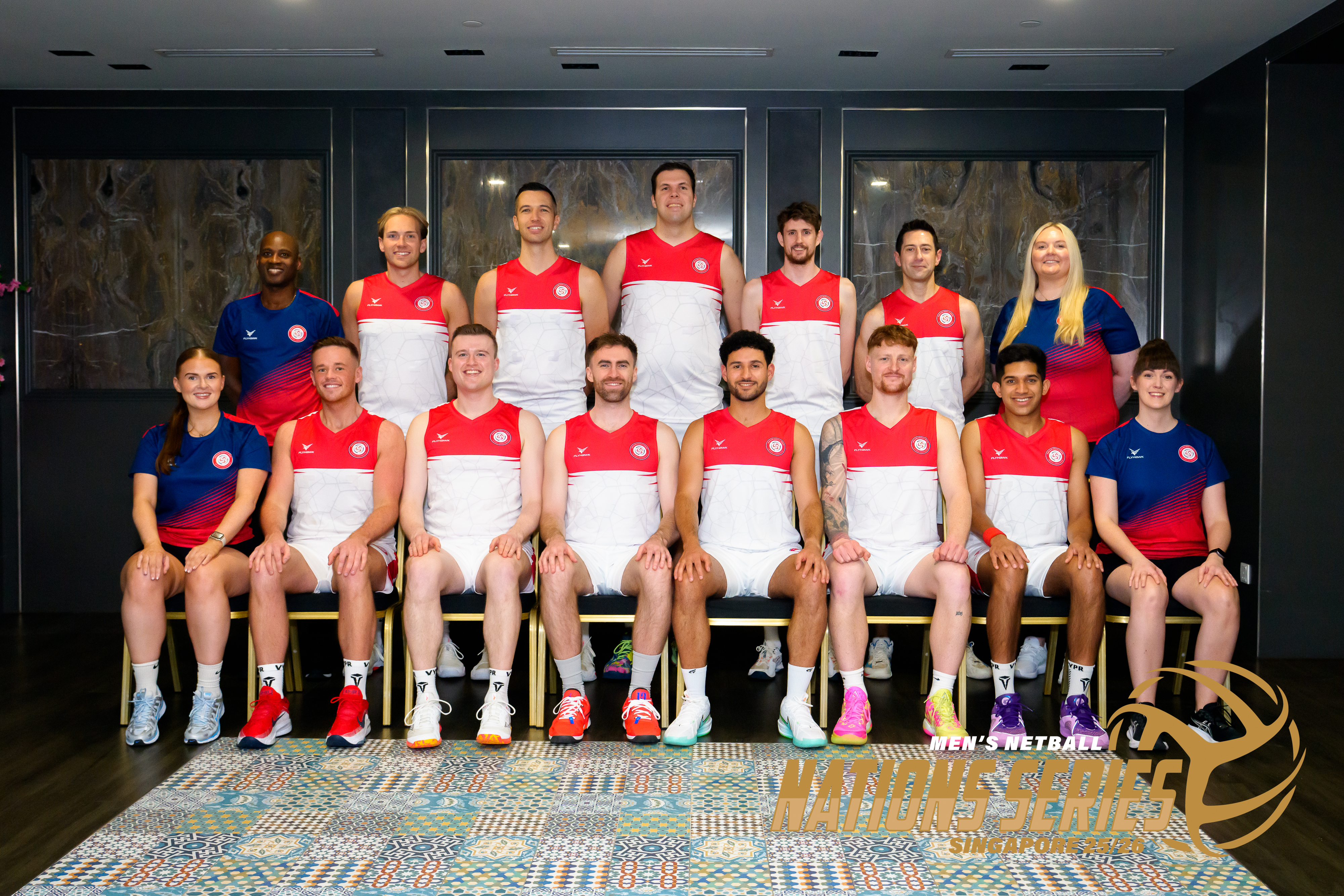 Netball team sitting and standing together