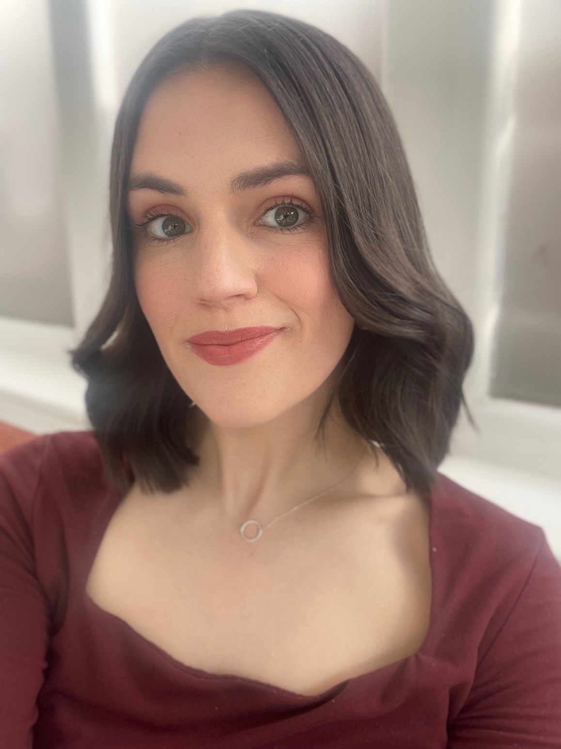 Lora smiling at the camera