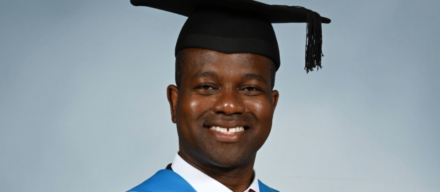 Justin in his graduation robes