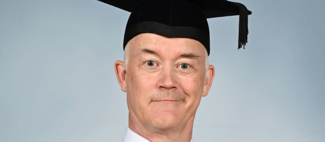 Colin in his graduation robes