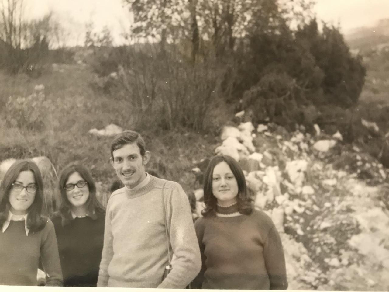 Four people standing looking at the camera, taken in the Dolomites in the seventies