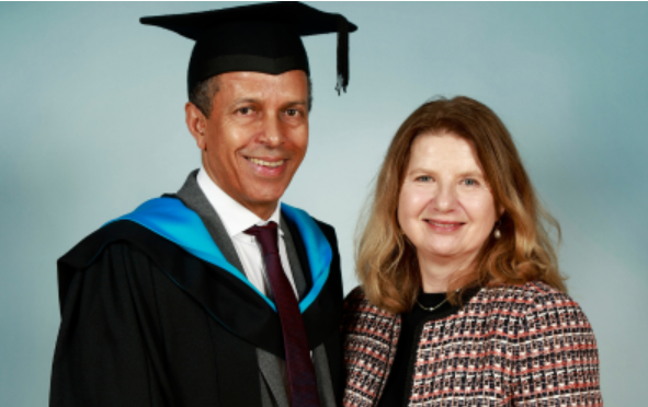 Paul and his wife - Paul is in graduation robes