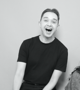 Joel laughing in a black and white photo