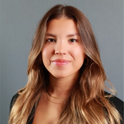 Headshot of Sara with a grey background