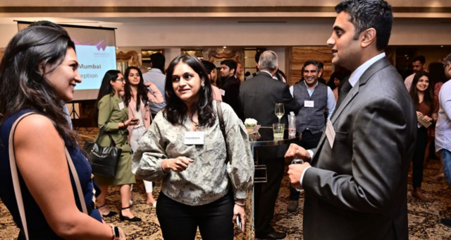 Alumni networking at an event