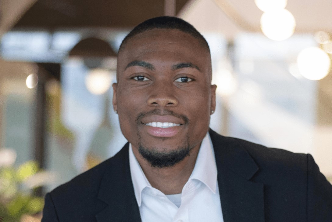 Michael Ojetunde wearing a formal suit