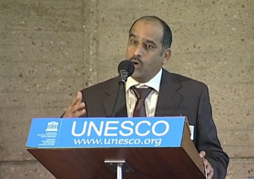 Mohammed speaking at a UNESCO podium