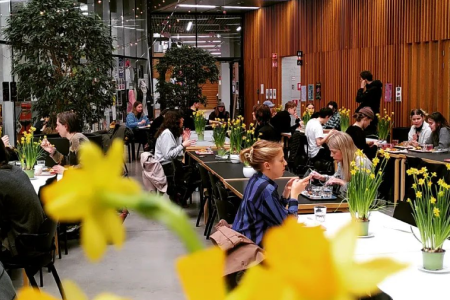 A lively canteen scene from a studen-owned vegan cateen in Finnish University canteen Kipsari