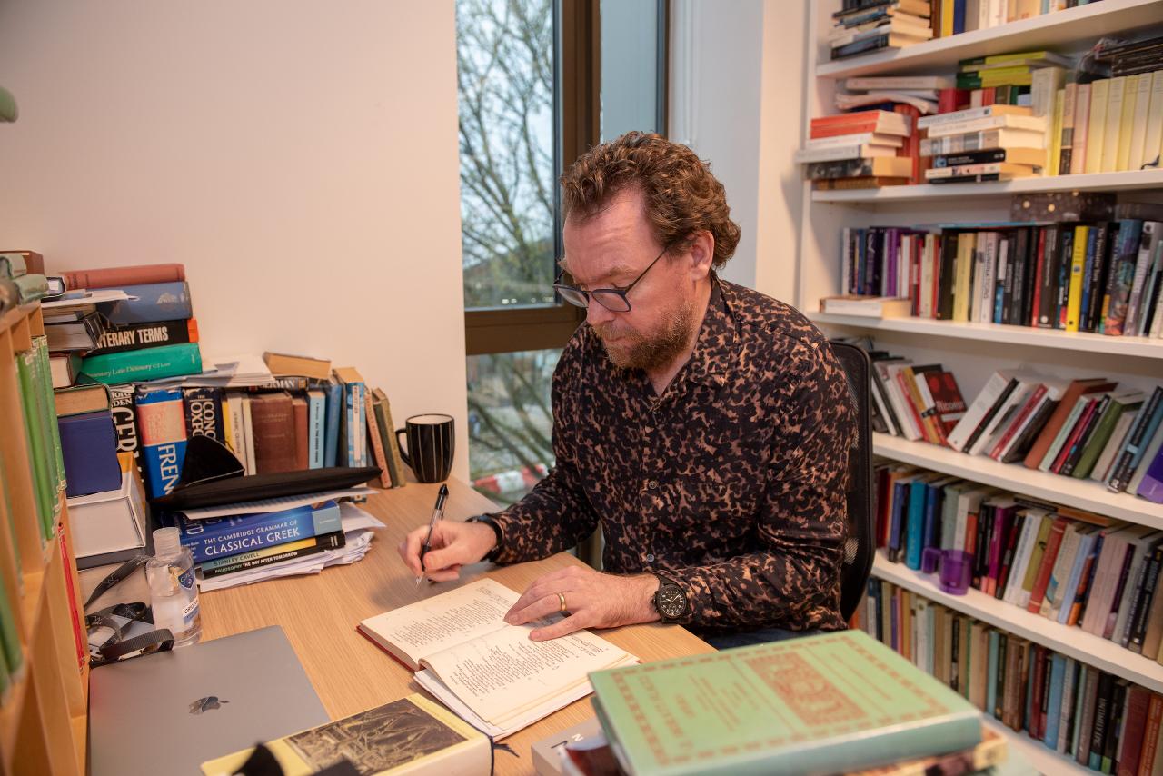 Photograph of Professor David Fearn working in an office
