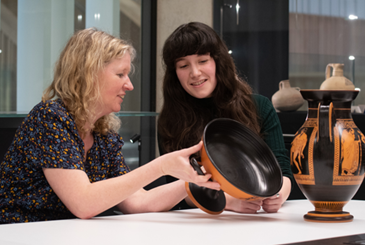 Image of Prof. Newby teaching with a pot