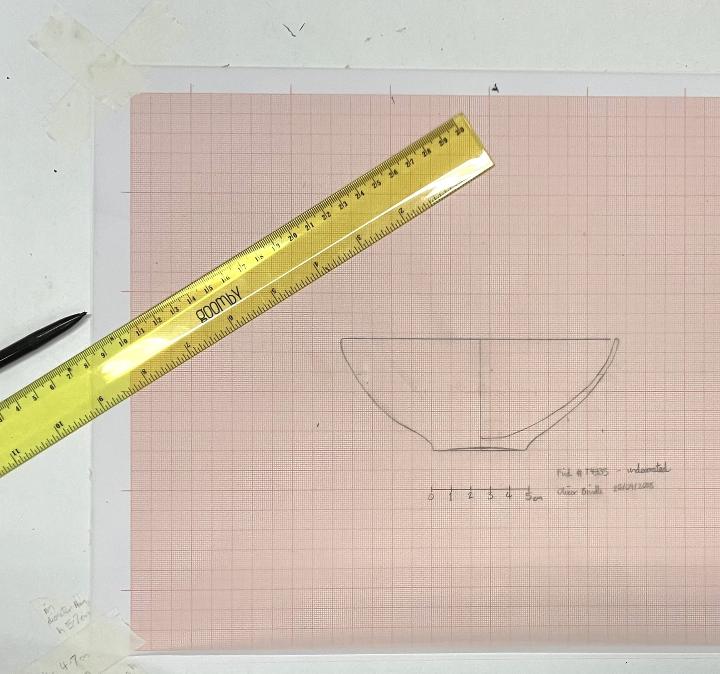 A pencil drawing of a Greek vase on graph paper.