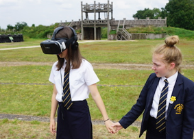 Pupils enjoying VR at Lunt Roman Fort