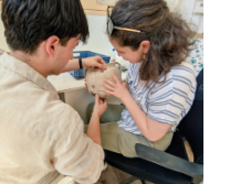 Isabella Vughan examines a pot at Knossos