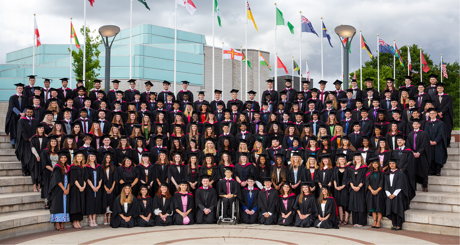 History Graduating Class of 2022. Group photo in the piazza. Hats on. 