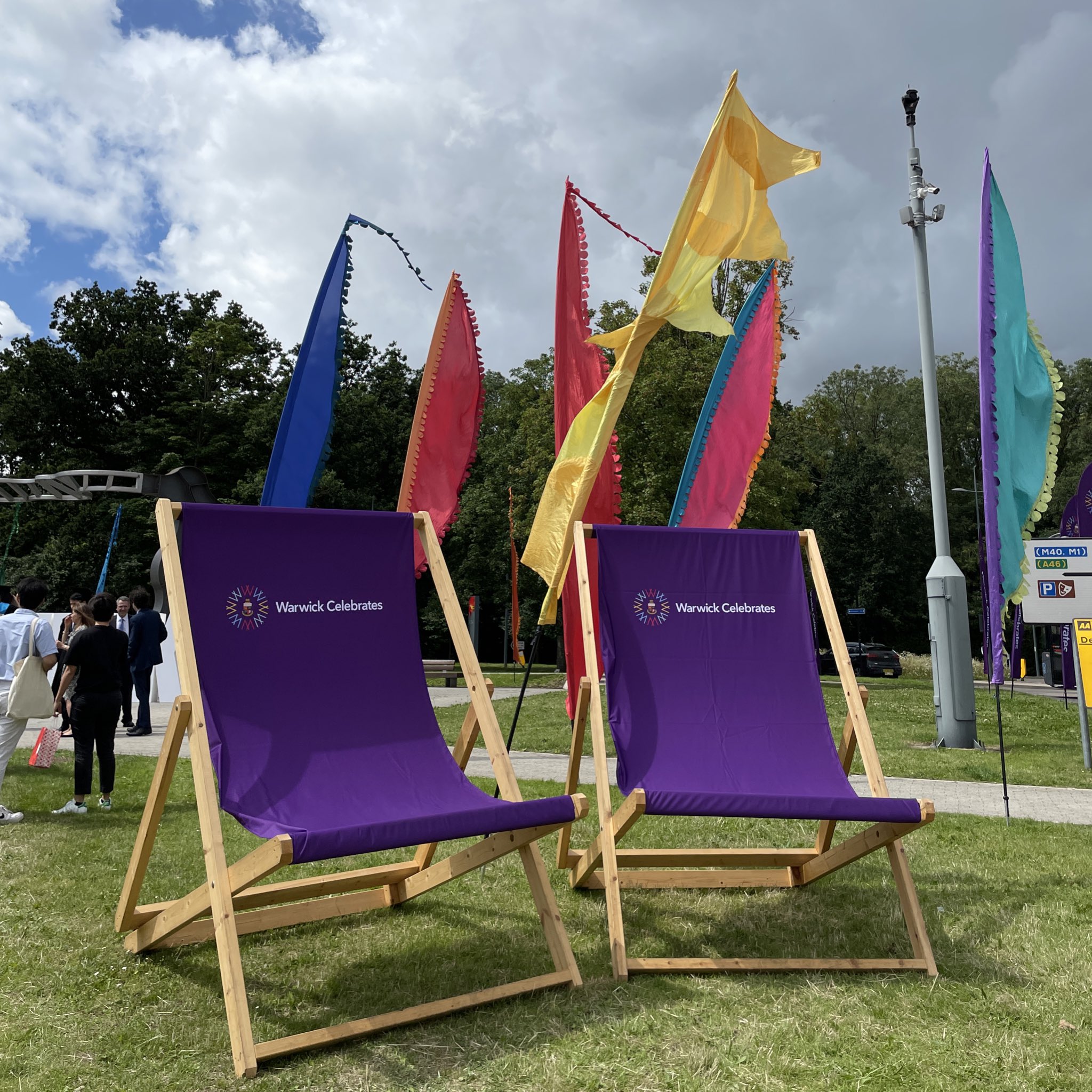 Image of two deckchairs which say Warwick graduation on them. 