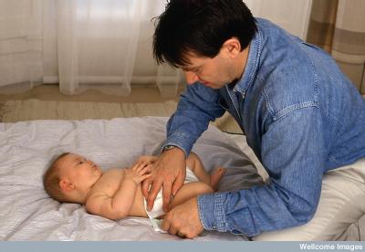 Dad changing nappy