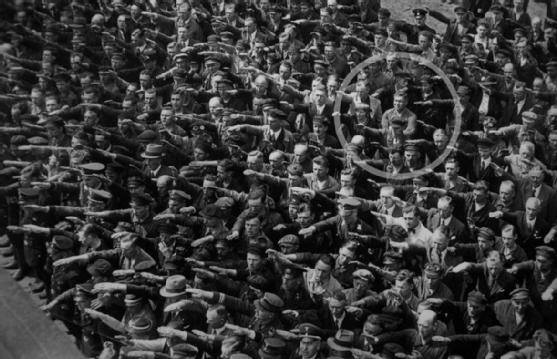 A lone man refuses to give the Nazi salute, 1936