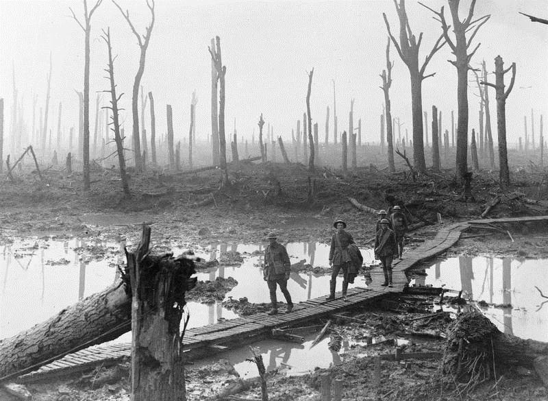 e-aus-1220-australian-troops-walk-along-duckboards-through-the-remains-of-chateau-wood-third-battle-of-ypres-pas.jpg