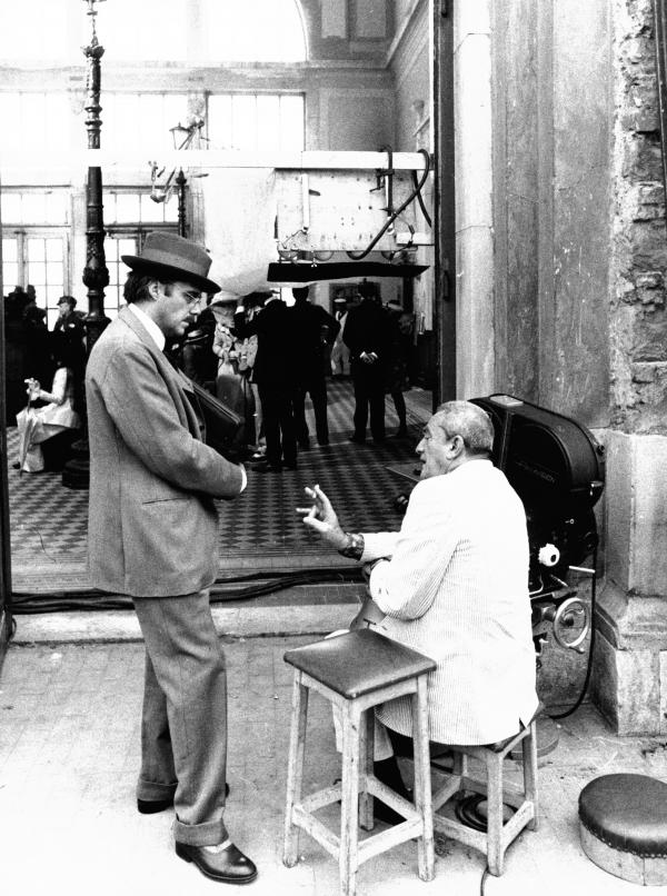 An actor speaks with his film director on set in Venice.