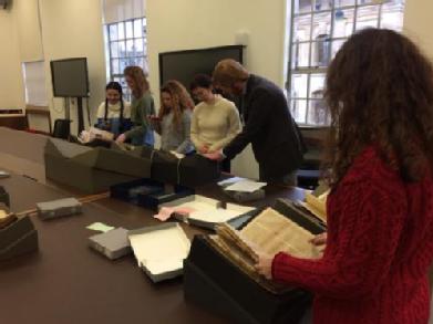 Students looking at manuscripts