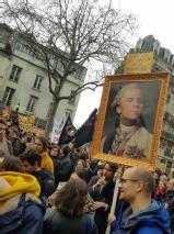 placard of president Macron as Louis XVI