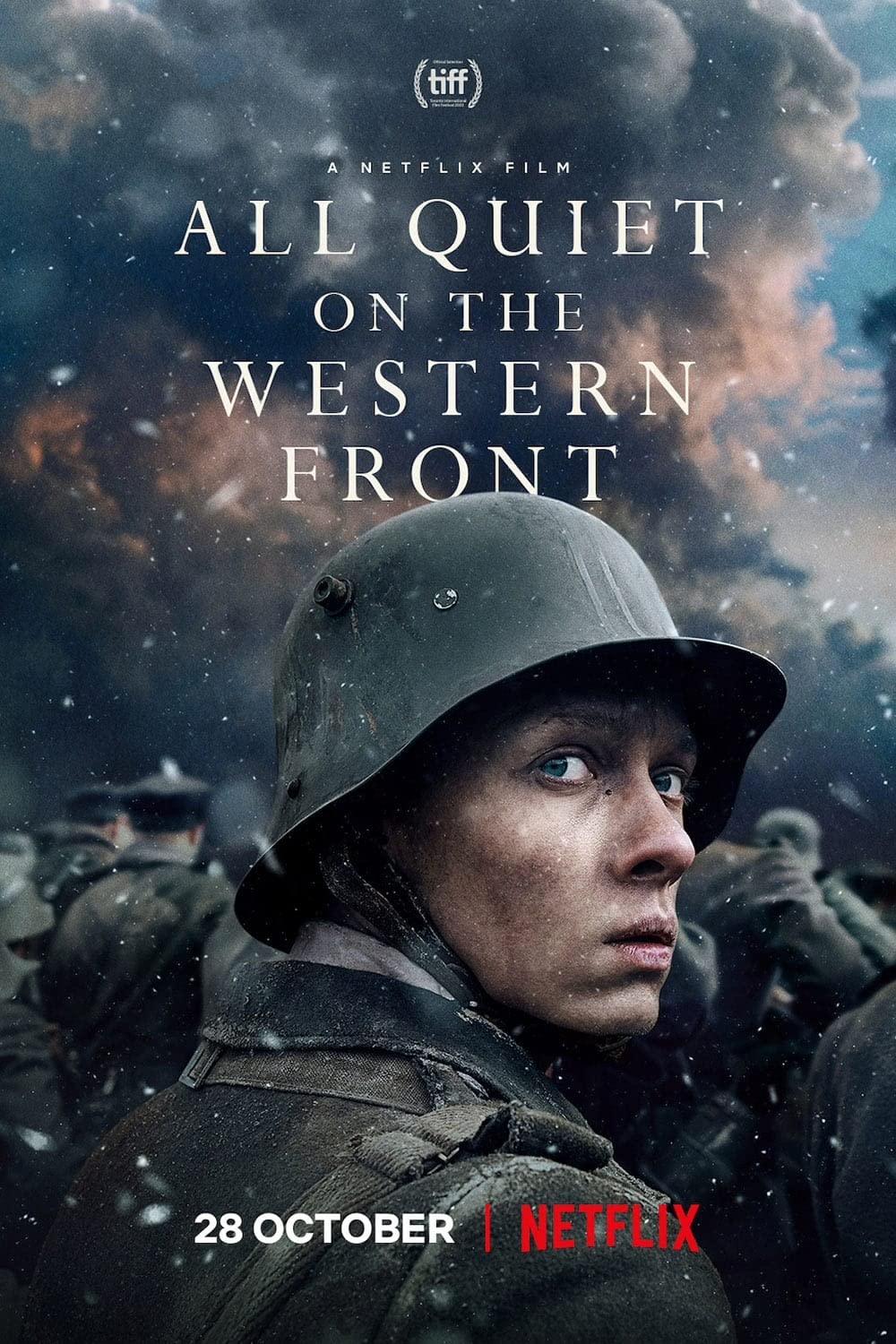 Netflix poster for the 2022 film All Quiet on the Western Front. The poster is portrait and focuses on the face of the young soldier Paul Bäumer who is looking over his shoulder. The background is of other soldiers with their backs to Paul, marching into the distance. 