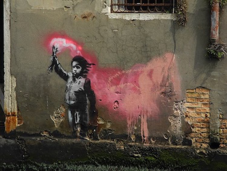 Banksy artwork of small boy holding red flare