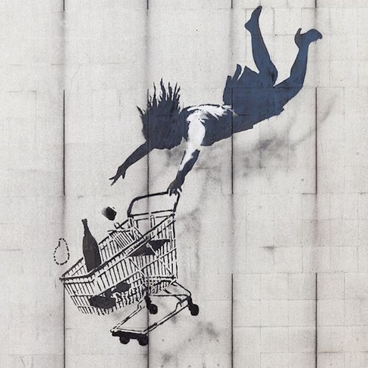 Banksy artwork of woman falling, holding shopping trolley