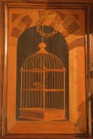 A beautiful intarsia image of a caged bird, Santa Corona in Vicenza. Late fifteenth century