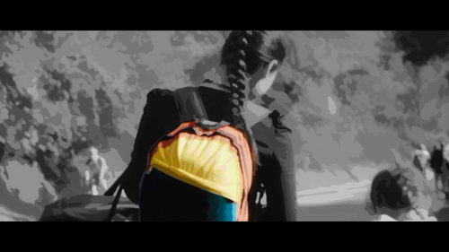 Image depicting a young woman with her daughter walking along a road, viewed from behind. The image is a stylised vector image in B&W, other than the young woman's backpack which is in colour, in the colours of the Venezuelan flag. 
