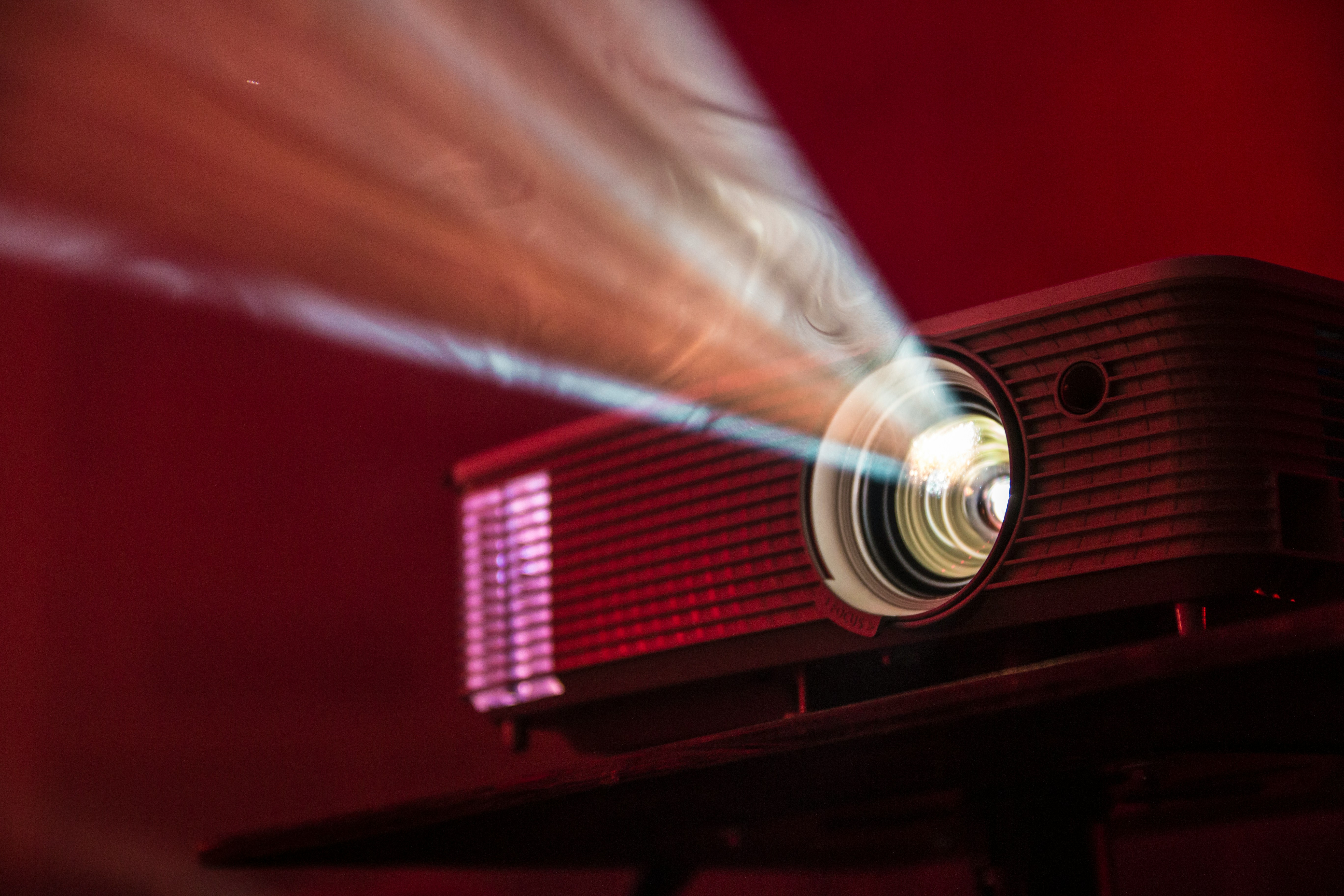 A photograph of an LED projector, projecting beams of light.