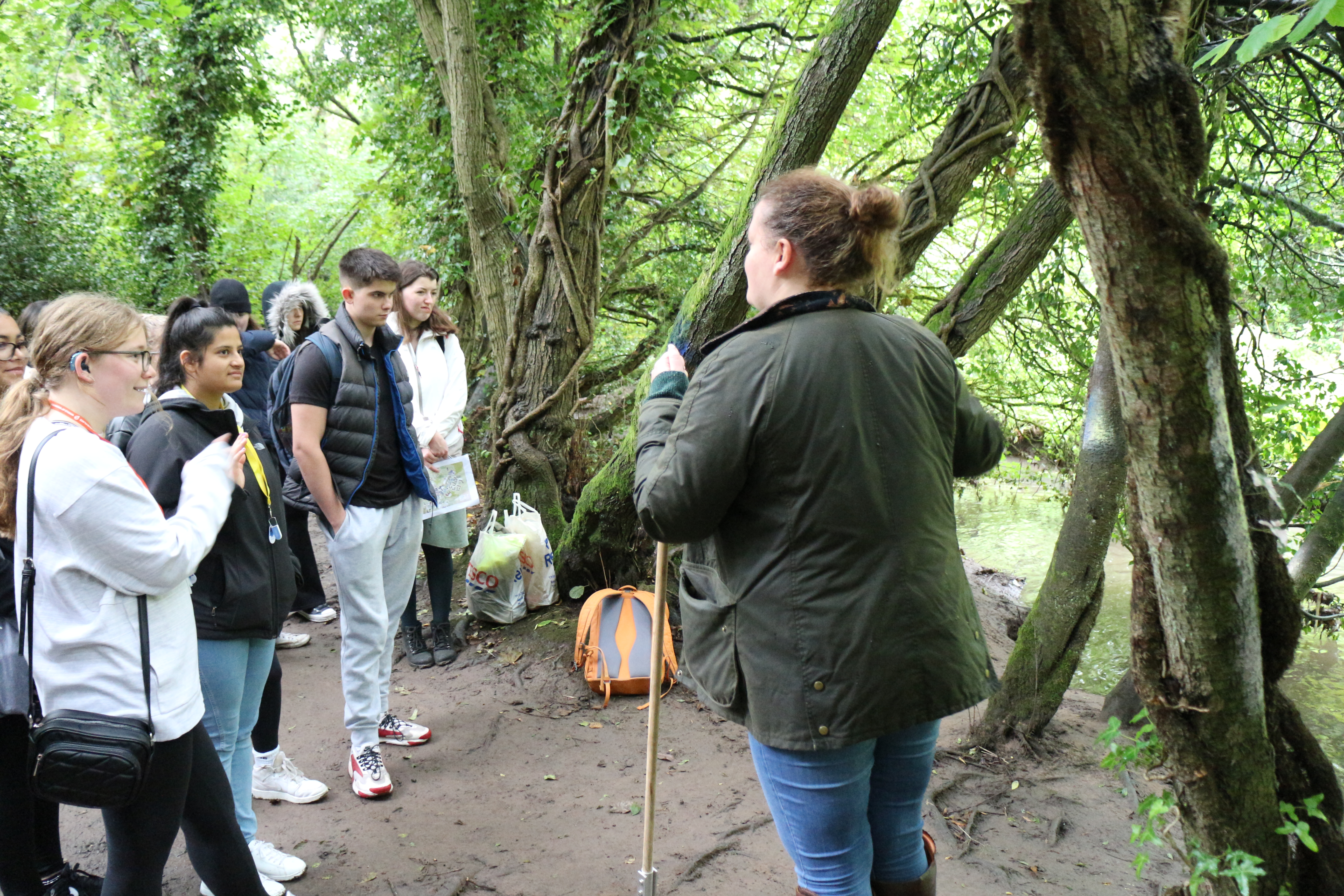 Undergraduate GSD students students in the woods with Dr Jess Savage, learning about biodiversity on campus