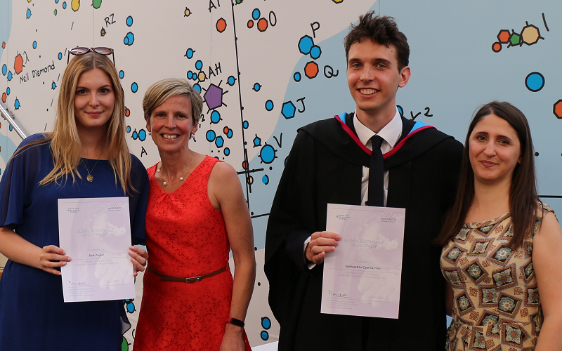 Beth Taylor and Szeb receiving their nomination, stood with the Head of School and Director of Student Experience.